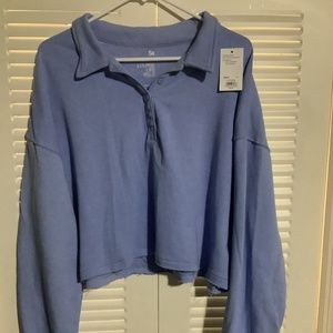 Brand new with tags, cropped women’s polo sweatshirt, size L, sky blue